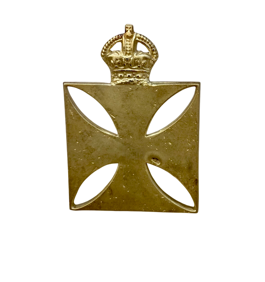 Gold cross badge with a crown on a white background