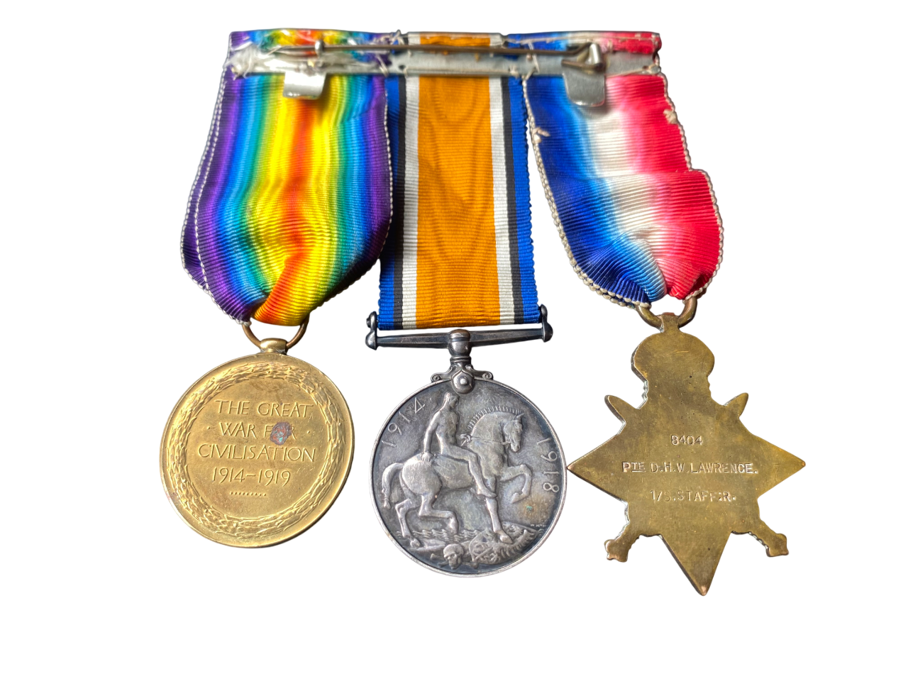 WW1 Medal Trio (Pip, Squeak & Wilfred) w/ Mons Clasp to Pte D. H. W. Lawrence - South Staffs